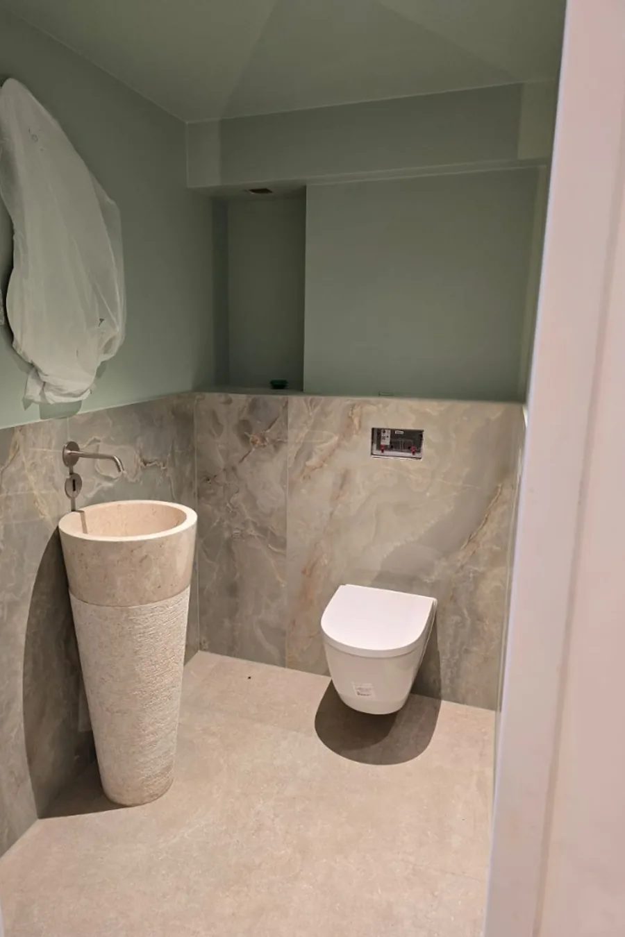 Form Soft — stone pedestal sink with sage upper walls