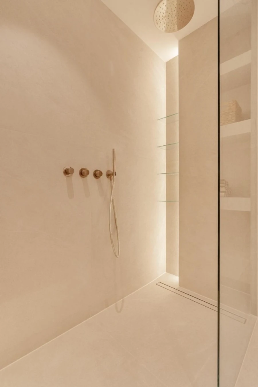 Garden Soft — sandstone walk-in shower with bronze fixtures