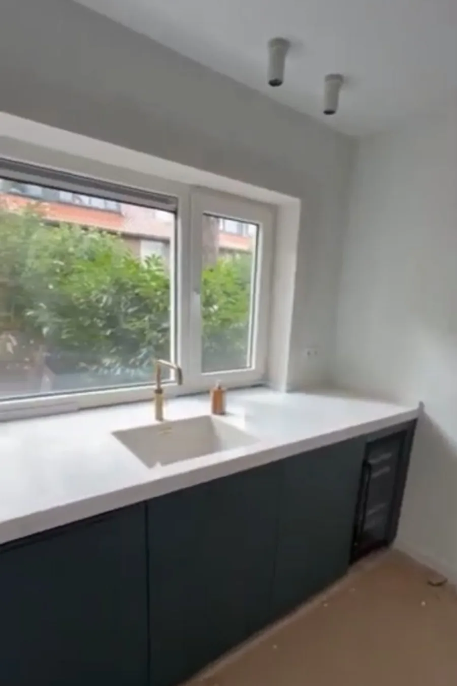 Ink Soft — white sink run with brass faucet and wine fridge