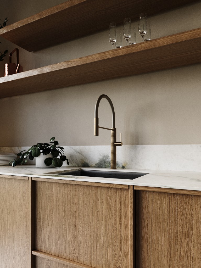 Pale Beam — brass faucet on white marble counter