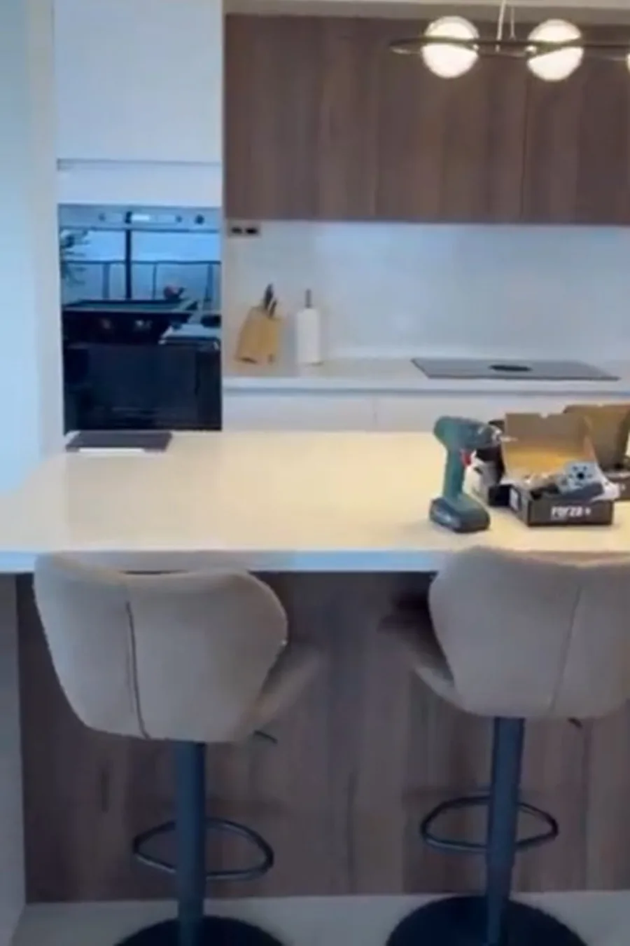 Play Soft — kitchen island with wood and white cabinetry