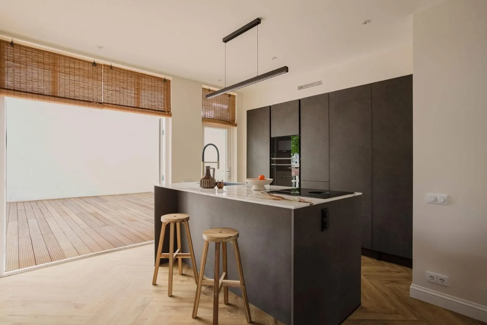 Warm Terrace — open kitchen with herringbone floor and terrace light